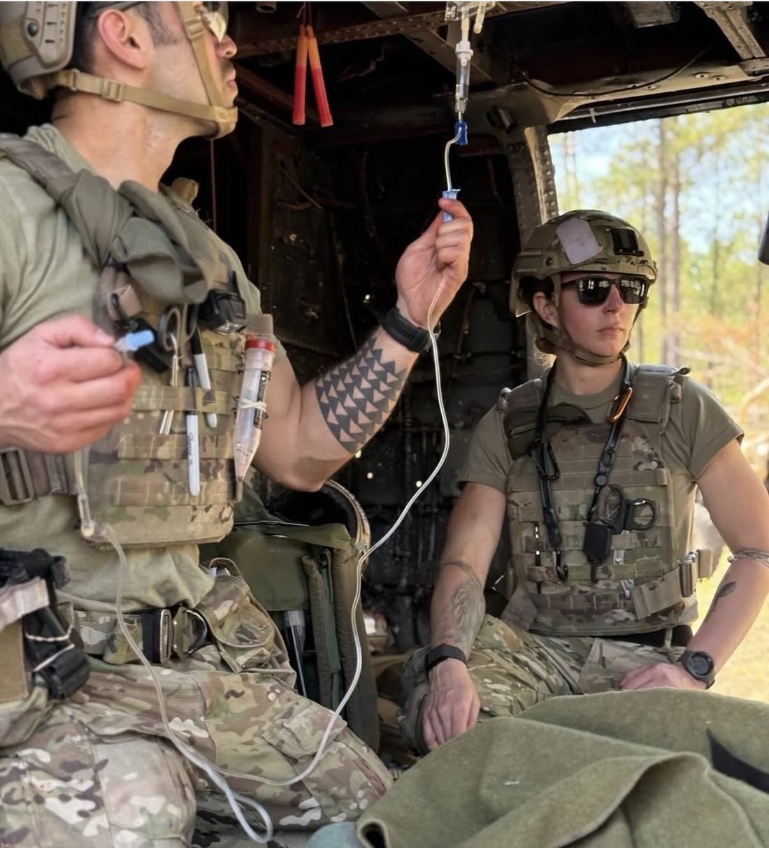 PHF program medics treating a patient aboard a Black Hawk helicopter