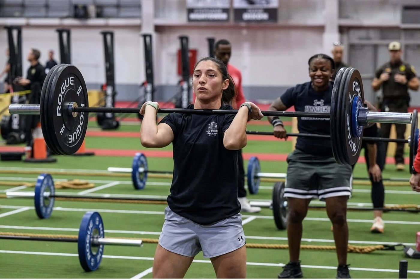 Athlete lifting a barbell at a Project Heroes First event